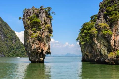 Close-up of karst limestone tower emerging andaman sea and other islets near Stock Photos