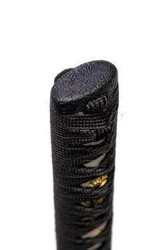Close up the Kashira: butt cap (or pommel) made of steel on the end of the bl Stock Photos