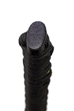 Close up the Kashira: butt cap (or pommel) made of steel on the end of the bl Foto stock