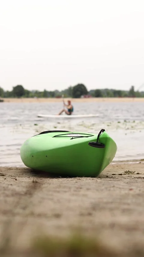 Close-up of a kayak lying on the sand on the beach Stock Footage 314132373
