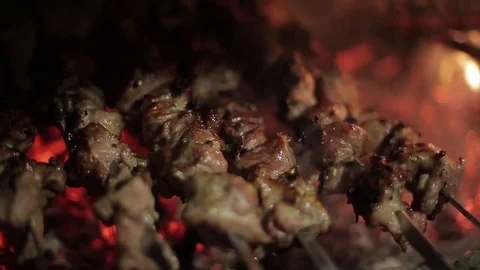 Close-up of kebabs preparing at the stake Stock Footage 71944196