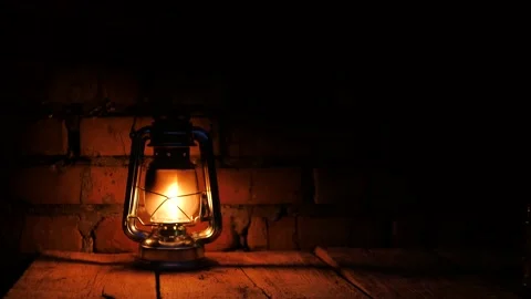 Close-up of a kerosene lamp against a brick wall. halloween party Stock Footage 218619336