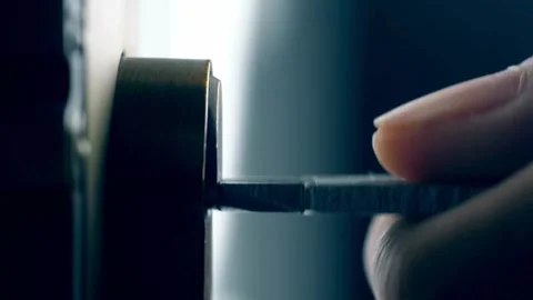 Close-up of Key Inserting into Door Lock Mechanism Stock Footage 309546766
