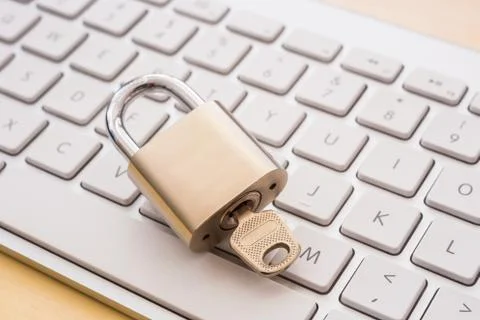 Close key lock on keyboard, blockchain security mechanisms. Stock Photos