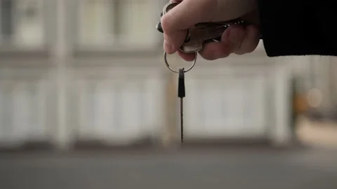 Close-up - the key to the new apartment in the hands of a man, buying a new a Stock-Footage 221447944