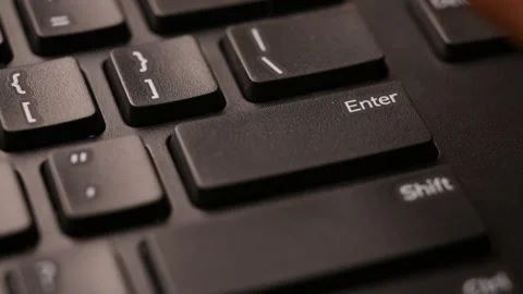 Close Up Keyboard Action of Man Using Enter Key for Data Submission on Computer Stock Footage 333576227