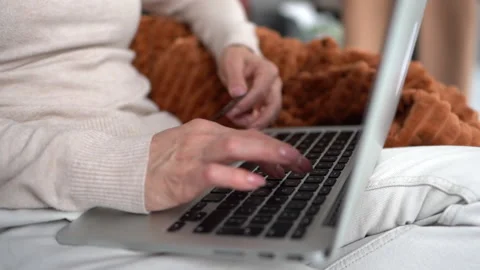 Close up of keyboard and laptop screen. Person is typing on a laptop. Business Stock Footage 152908425