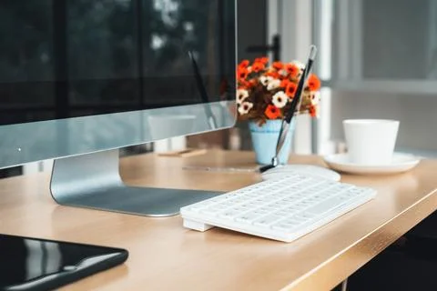 Close up keyboard desktop PC computer on table in small modern office Jivy Stock Photos