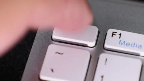 Close-up of keyboard keys and blurred finger in motion Stock Footage 337789372