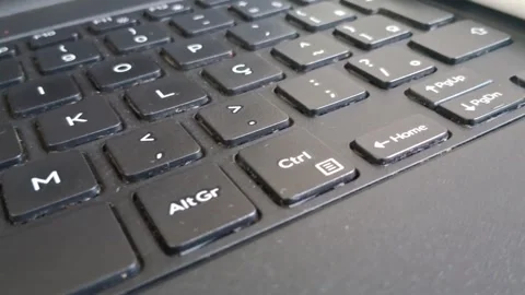 Close up keyboard keys with motion showing typing work footage Stock Footage 339031311