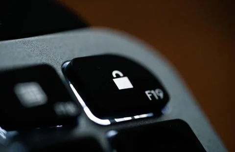 Close up of Keyboard lock key on space grey metal Stock Photos