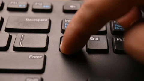 Close Up of Keyboard with Man Using Delete Key to Clear Selected Data Stock Footage 333579558