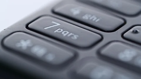 Close Up keyboard of the old Nokia 301 mobile phone. Tracking right shot Stock Footage 117869476