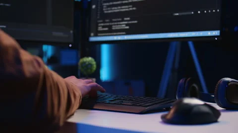 Close up of keyboard used by software engineer programming at home Stock Footage 265337539