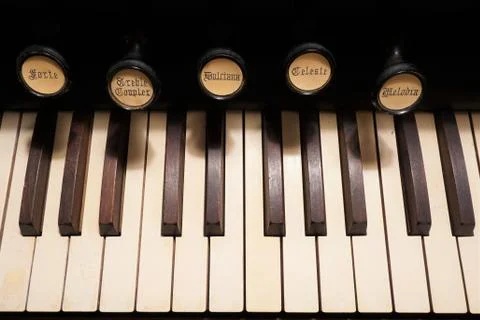 Close up of the keys and stops of an old pump organ Foto stock