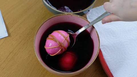 Close up of kid hands coloring easter eggs with egg dye. View from above Stock Footage 123041728