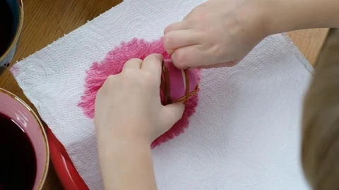 Close up of kid hands coloring easter eggs with egg dye. 動画素材 123226248