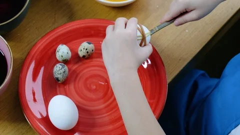 Close up of kid hands coloring easter eggs with egg dye. Stockbeeldmateriaal 123331675