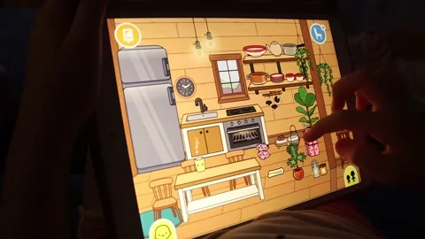 Close up kid hands playing a game at night on a tablet Stock Footage 200909892