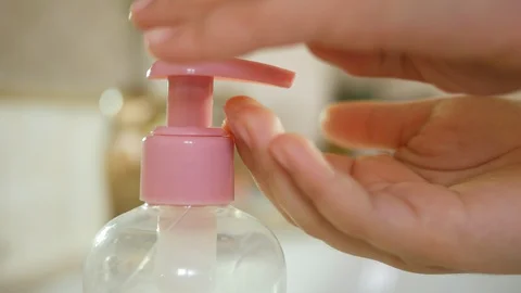 Close up kid hands using using a dispenser of cleansing solution, liquid soap Stock Footage 130076664