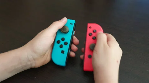 Close UP kid playing with nintendo joypad stick controller Stock Footage 135746708