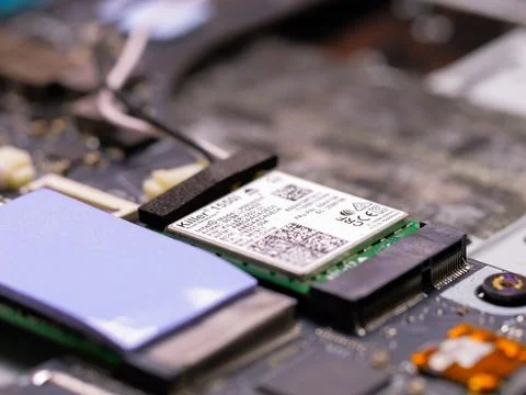 Close-up of Killer 1550i Wireless Network Card on Laptop Motherboard 库存照片