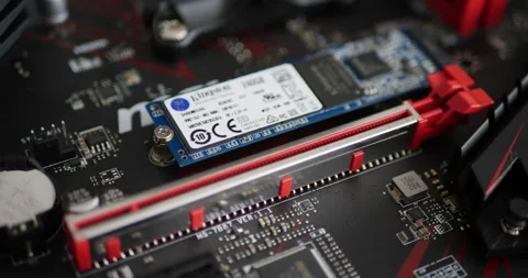Close up of a Kingston M.2 SSD drive memory stick on a gaming motherboard Stock Footage 139019503