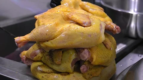 Close-up in kitchen burn, chicken carcass from small hairs with gas burner Stock Footage 267279933