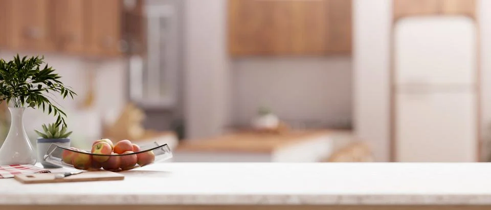 A close-up of a kitchen countertop with a blurred background of a contempor.. Stock Illustration