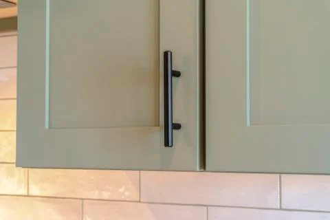 Close up of kitchen cupboard missing a handle Stock Photos