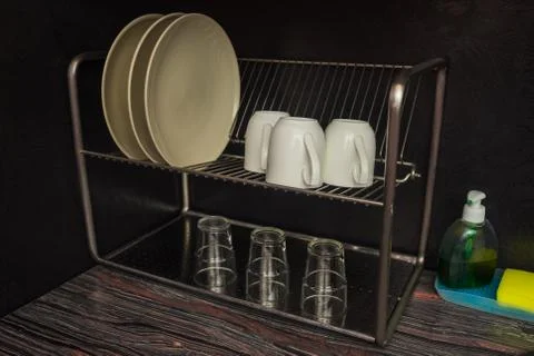 A close kitchen with dishes and a sink Stock Photos
