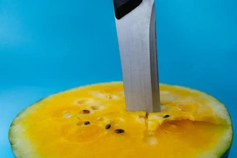 Close-up of a kitchen knife inserted into. Stock Photos
