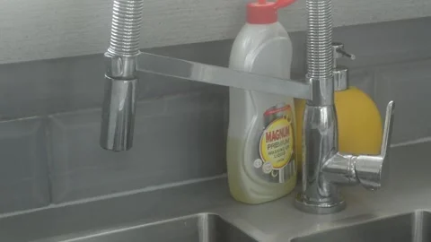 Close up of kitchen sink tap Stock Footage 247561076