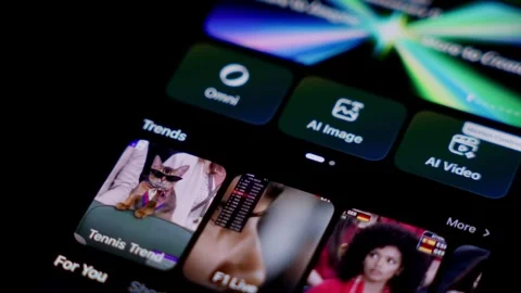 Close-up of the KLINGAI app open on a smartphone in a dark setting. Shows the Stock Footage 337239615