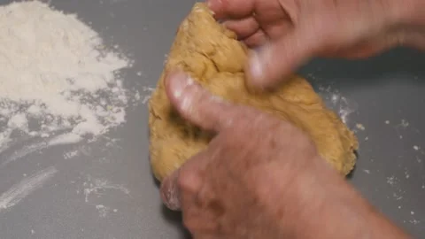 Close-up of kneading dough for making bread with their own hands. On the table Stock Footage 166622988