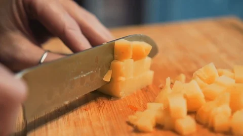 Close-up of the knife blade while slicing boiled potatoes Stock Footage 112765512