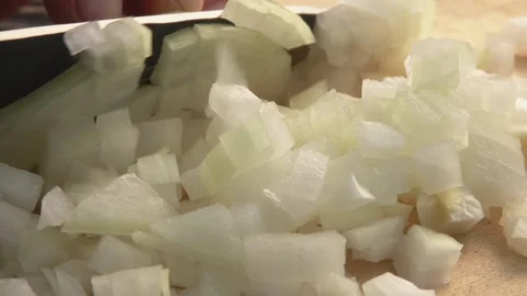 Close-up of the knife cutting onion into cubes on the board Stock Footage 143254803