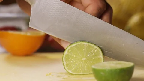 Close up of a knife cutting through a lime Video stock 83340840