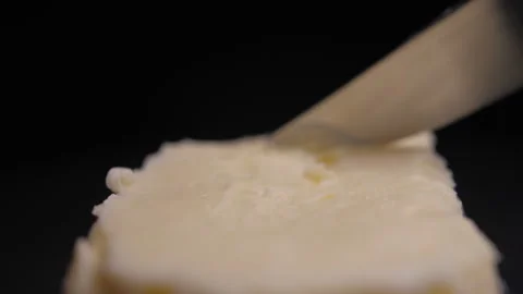 Close up knife scraping butter Stock-Footage 148333356