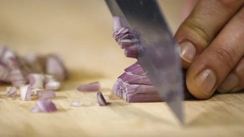 Close up of knife slicing shallot 스톡 동영상 124241793