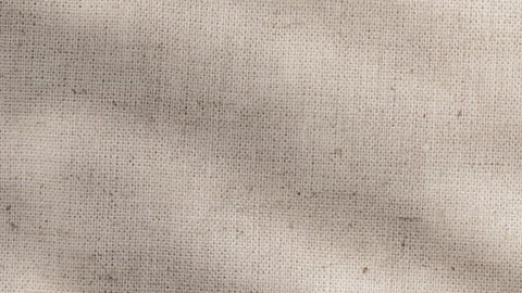 Close-up of knit canvas linen fabric with sun rays and visible fibers Stock Footage 312098178