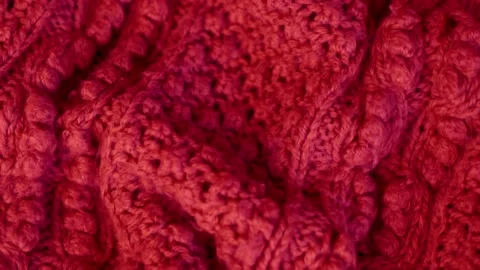 Close-up of the Knitted Patterned Wool Texture of Red Clothing Plaid Fabric. Gar Stock Footage 136746194