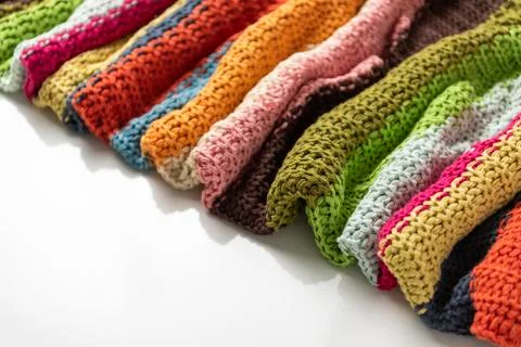 Close-up of knitted wool blanket on white background. Stock Photos