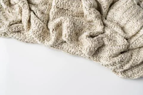 Close-up of knitted wool blanket on white background. Stock Photos