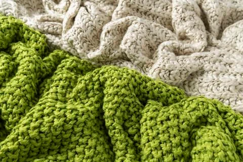 Close-up of knitted wool blankets on white background. Stock Photos