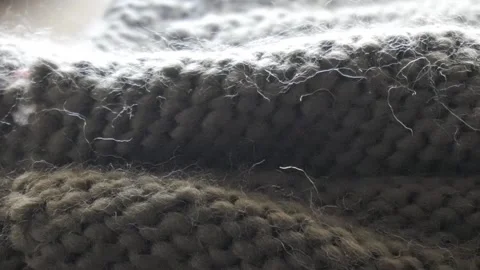 A close-up of a knitting project in progress, featuring pink knitting Stock Footage 285055868