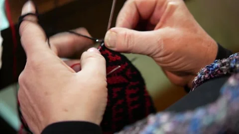 Close-up of knitting woolen socks in the traditional way Stock Footage 148120569
