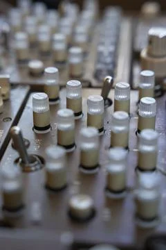Close up on knobs on an audio control panel Stock Photos
