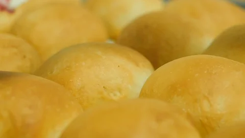 Close up of kolache baked round bread gets coated in butter slow motion Stock Footage 93370618