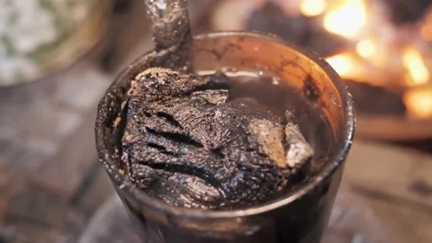 Close up of Kopi Jos. Coffe drinks with charcoal at Angkringan in Stock Footage 228352591